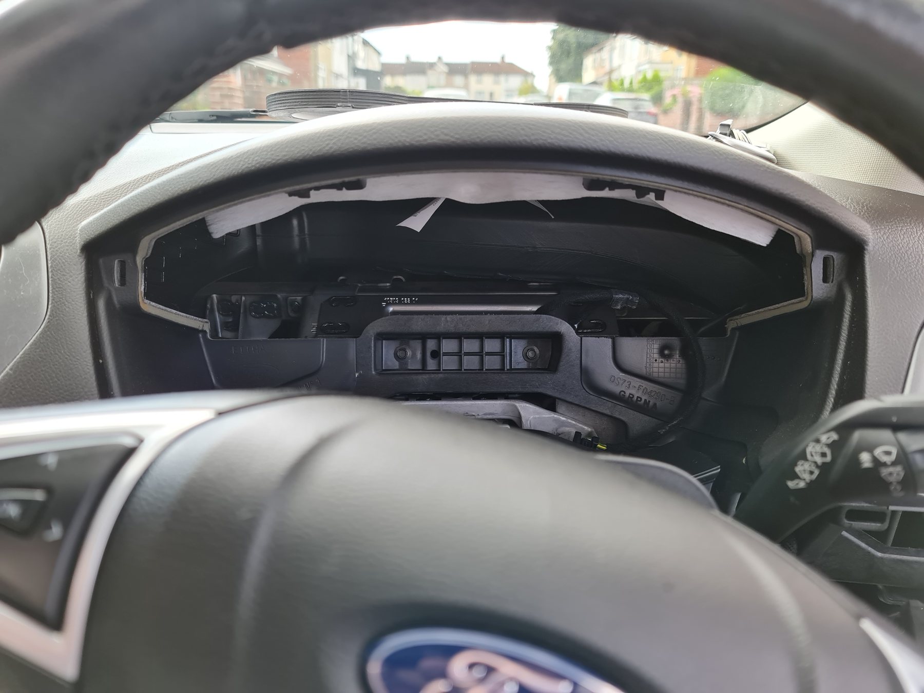 Console retrofit work on a Ford vehicle