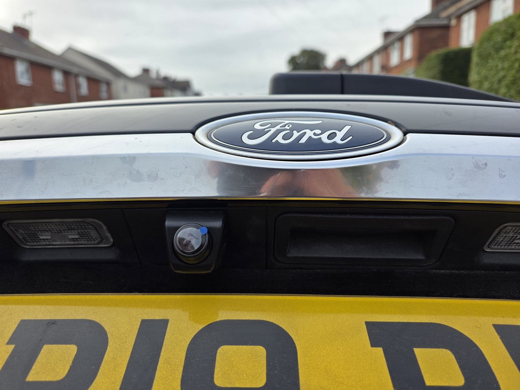 Camera retrofit work on a Ford vehicle
